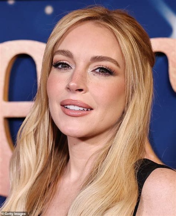 Back to Blonde: Lindsay Lohan emerges from an LA hair salon with newly dyed honey-coloured locks