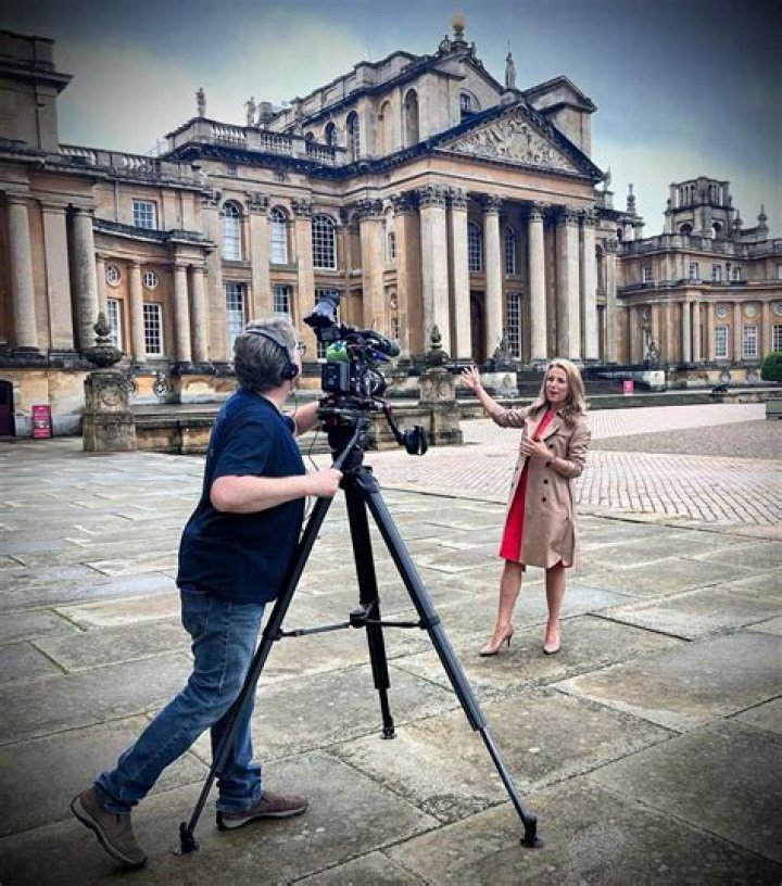 Christina Trevanion posing behind the camera on the sets of Bargain Hunt.