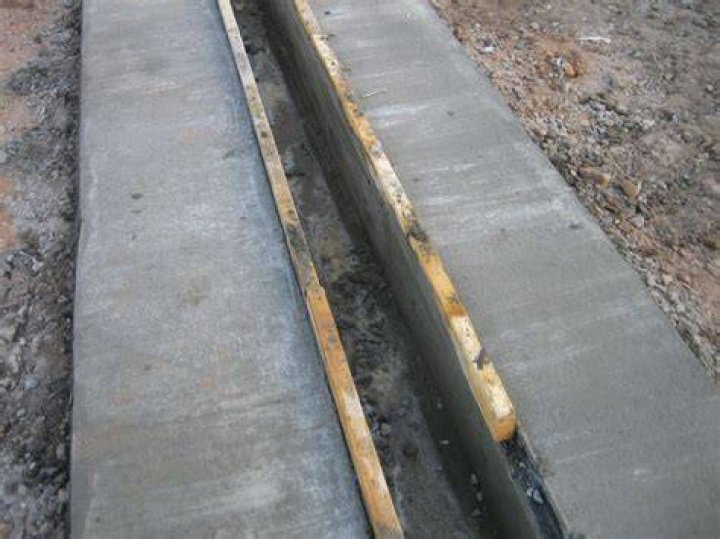 How do you build a trench drain?