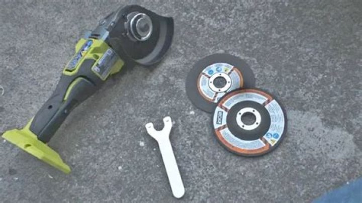 How do you remove the blade from a Ryobi angle grinder?