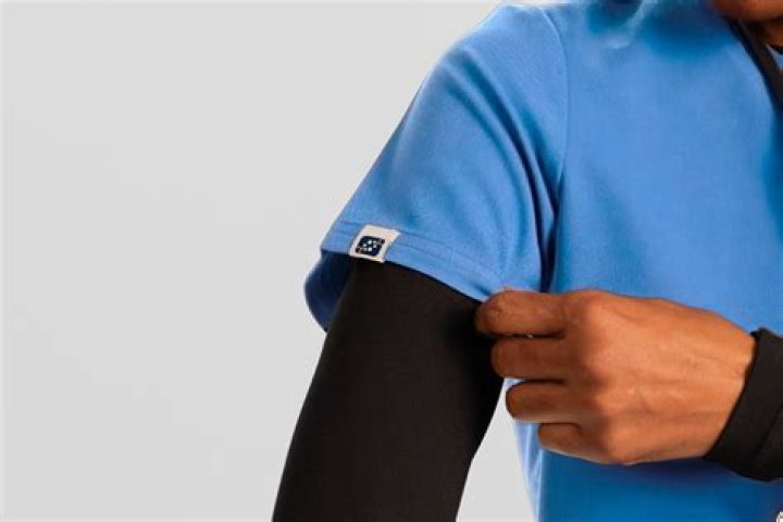 How do you shrink a scrub top?