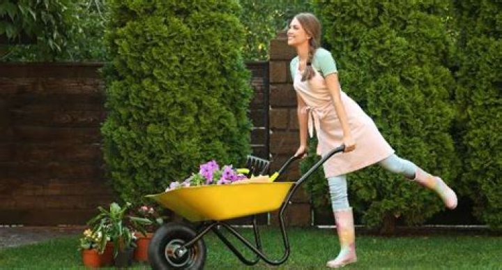 How does a wheelbarrow make work easier?